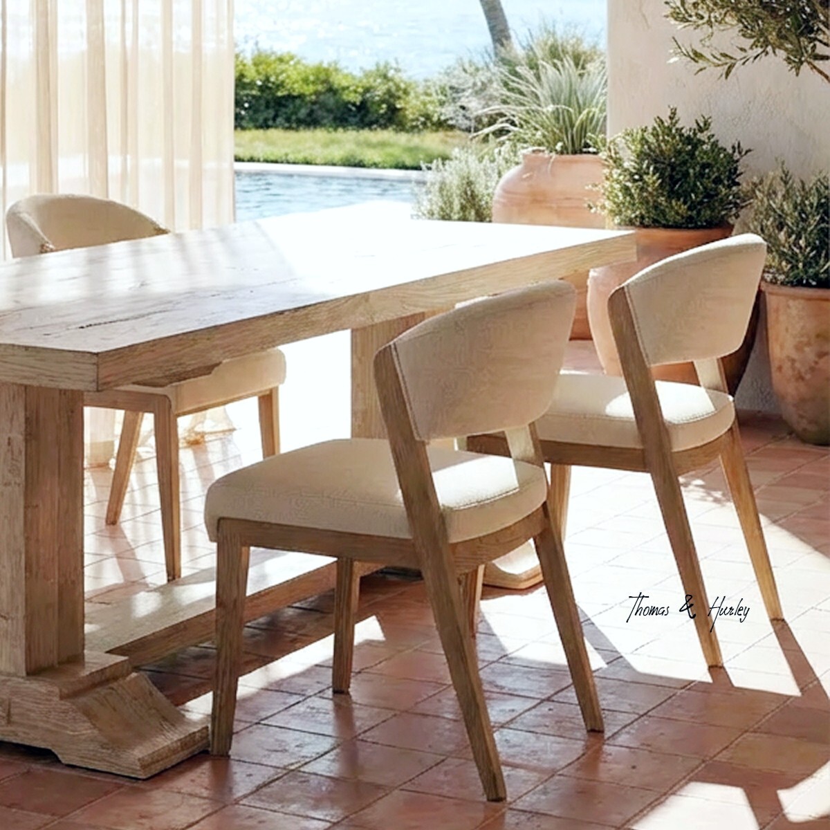 Stanton dining chair in premium textured natural upholstery with solid timber legs and refined Hamptons-inspired silhouette